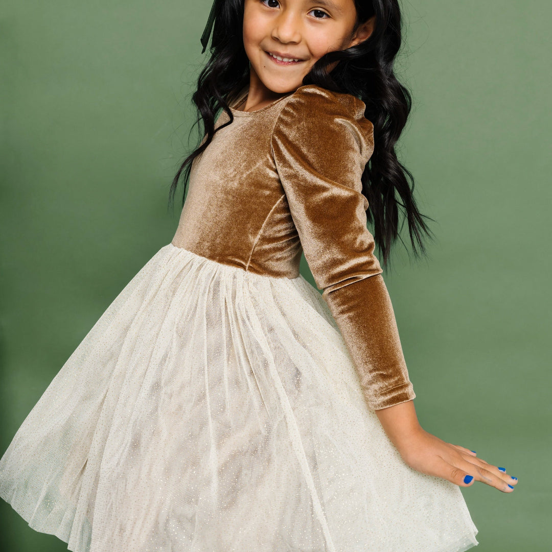 little girl twirling in rainbow heart dress
