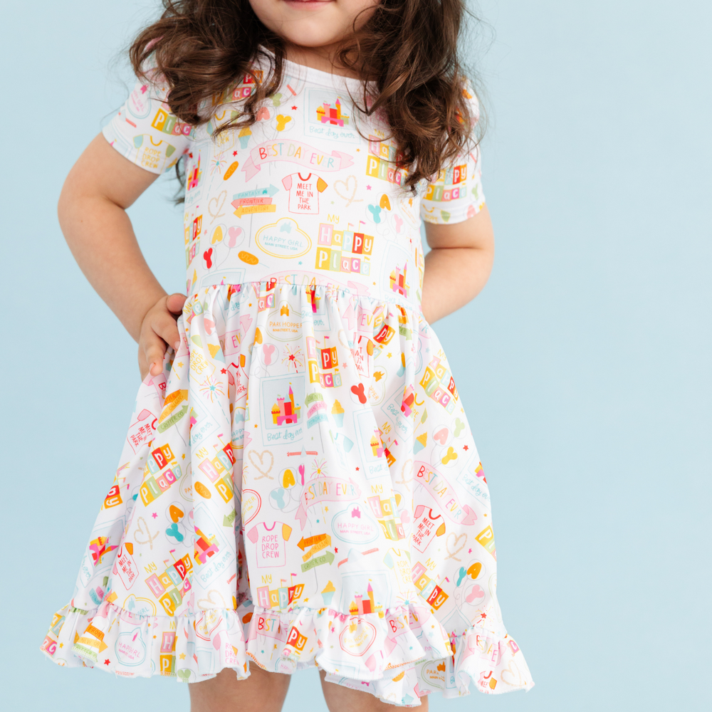 close up picture of little girl wearing disneyland inspired twirl dress