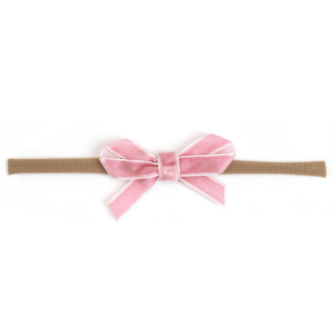 baby girl's light pink velvet ribbon bow on stretchy nylon headband for spring and easter