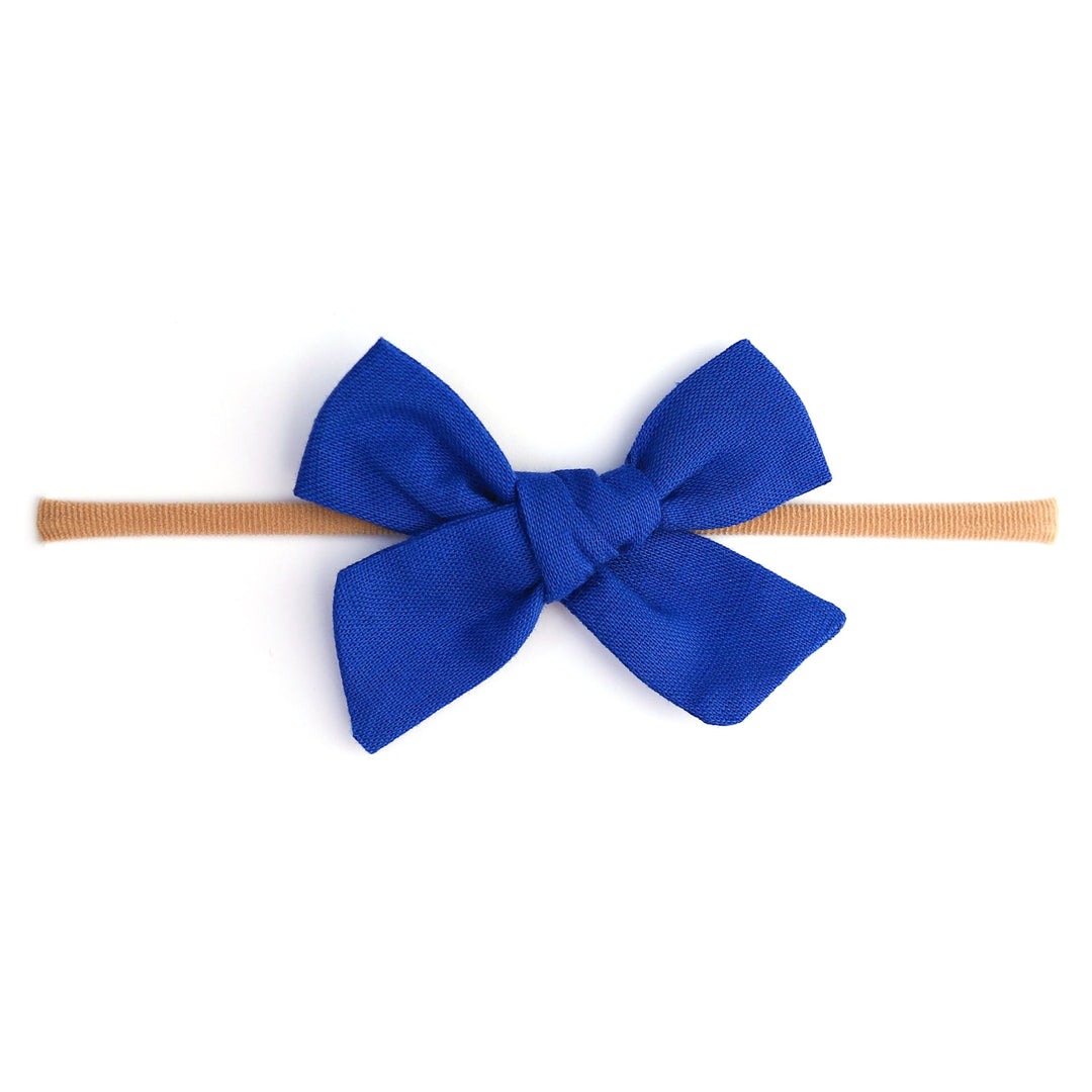 royal blue linen hair bow for babies on tan nylon band