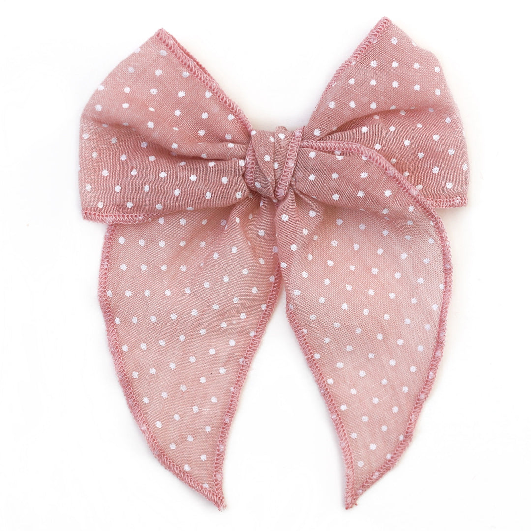 blush pink girls hair bow with tiny white dots