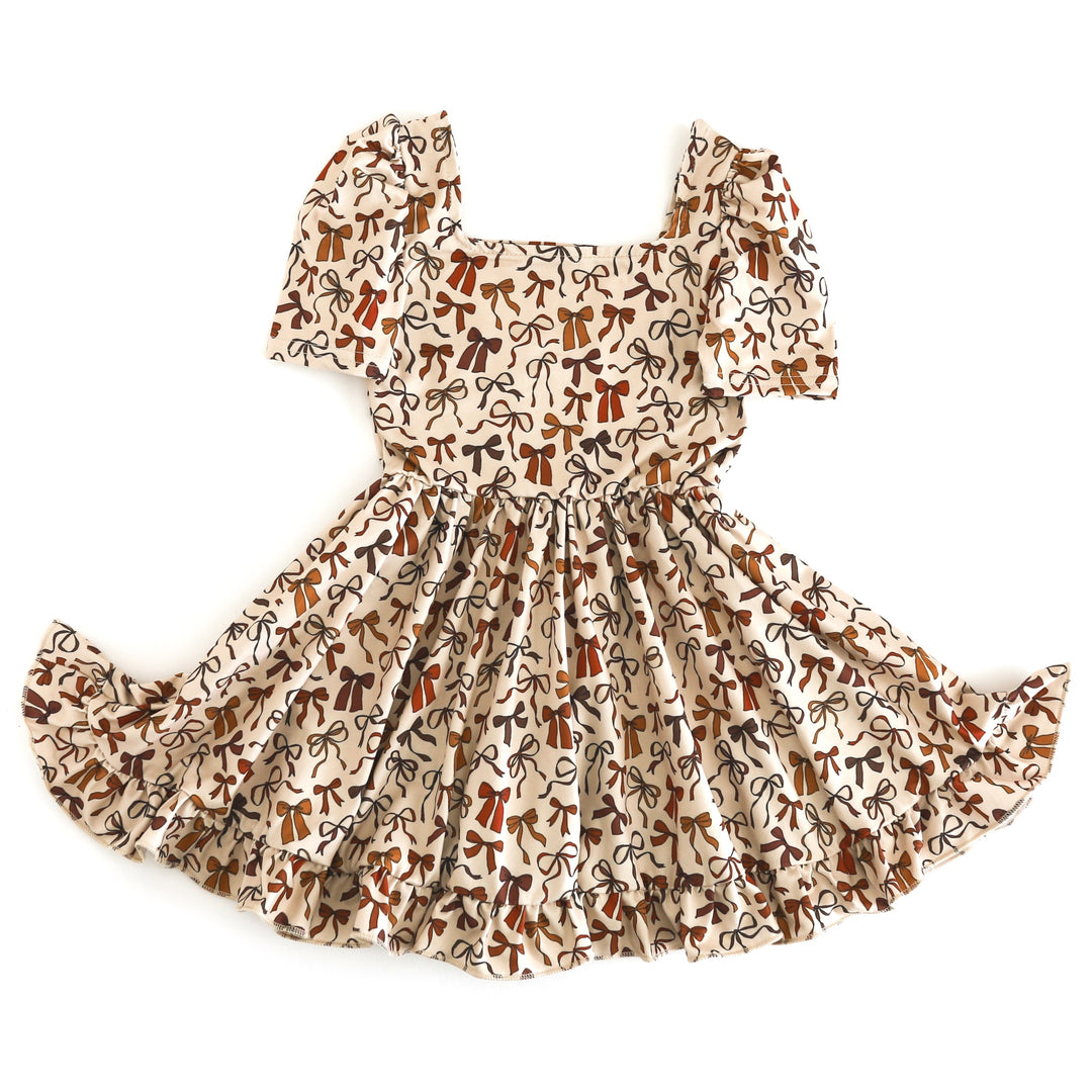girls' short sleeve cream twirl dress with bow print in fall shades
