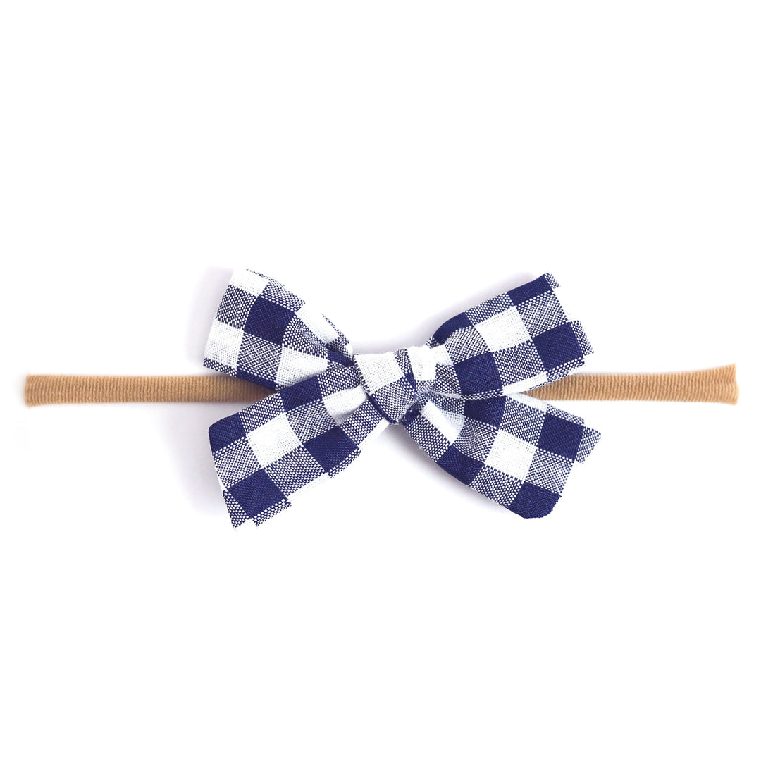 bright navy and white gingham baby bow on nylon headband