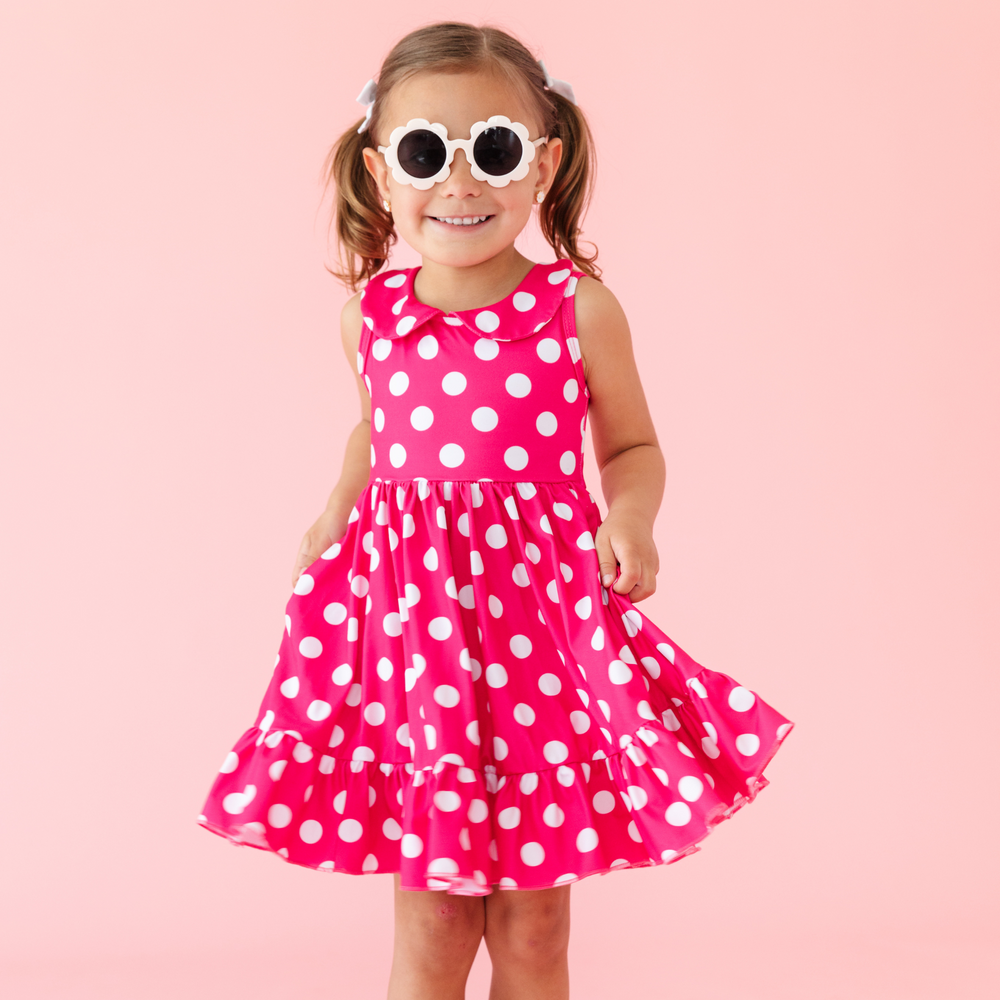 little girl wearing hot pink and white polka dot dress