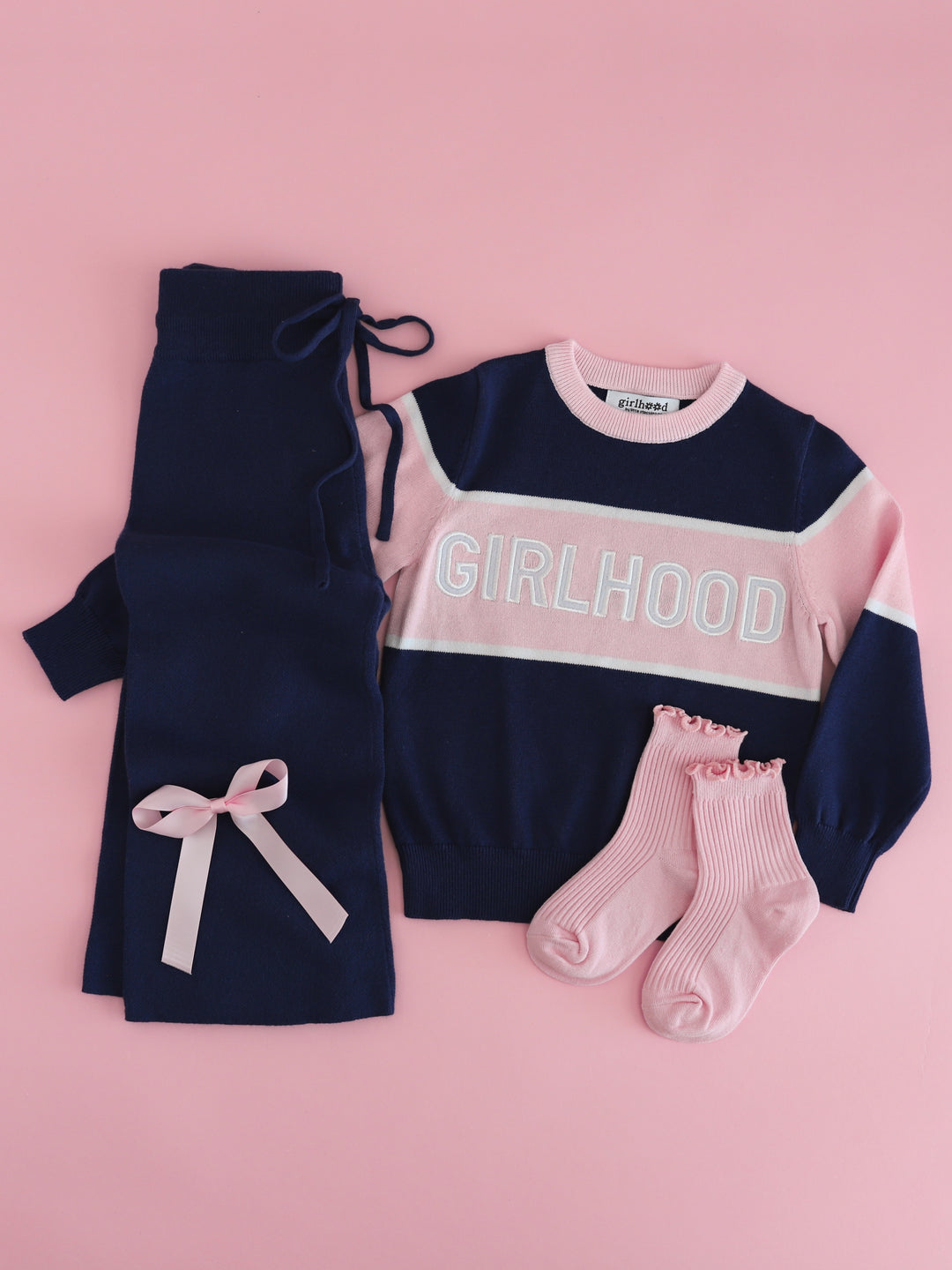 girl's navy and pink girlhood sweater set with matching pink midi socks and satin bow for back to school and fall