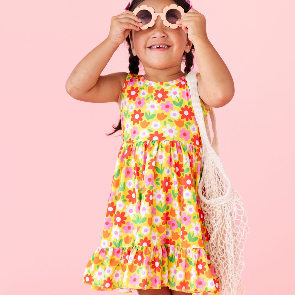 little girl wearing neon floral summer dress