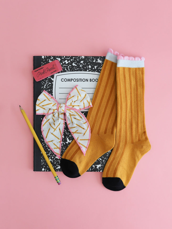 girls' pencil print fabric bow with pink trim and matching pencil design knee highs with school supplies