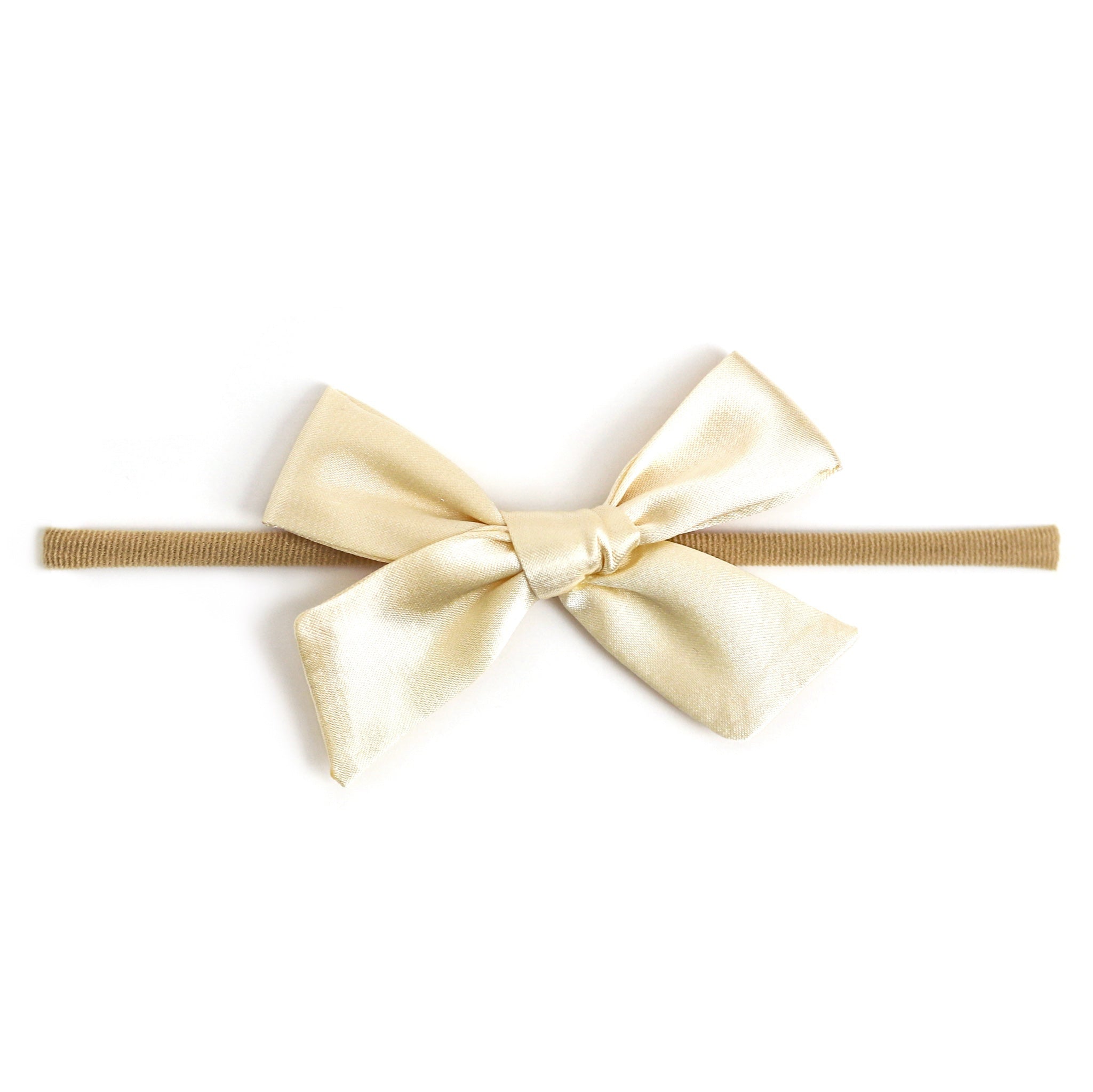 cream satin bow on soft nylon band for baby girl