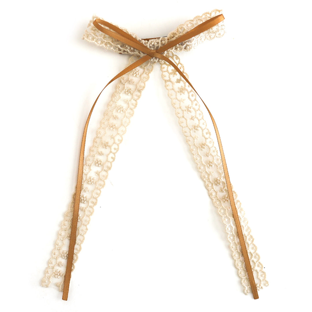 girls' double bow featuring lace long tail bow in cream with thin mustard ribbon attached on clip