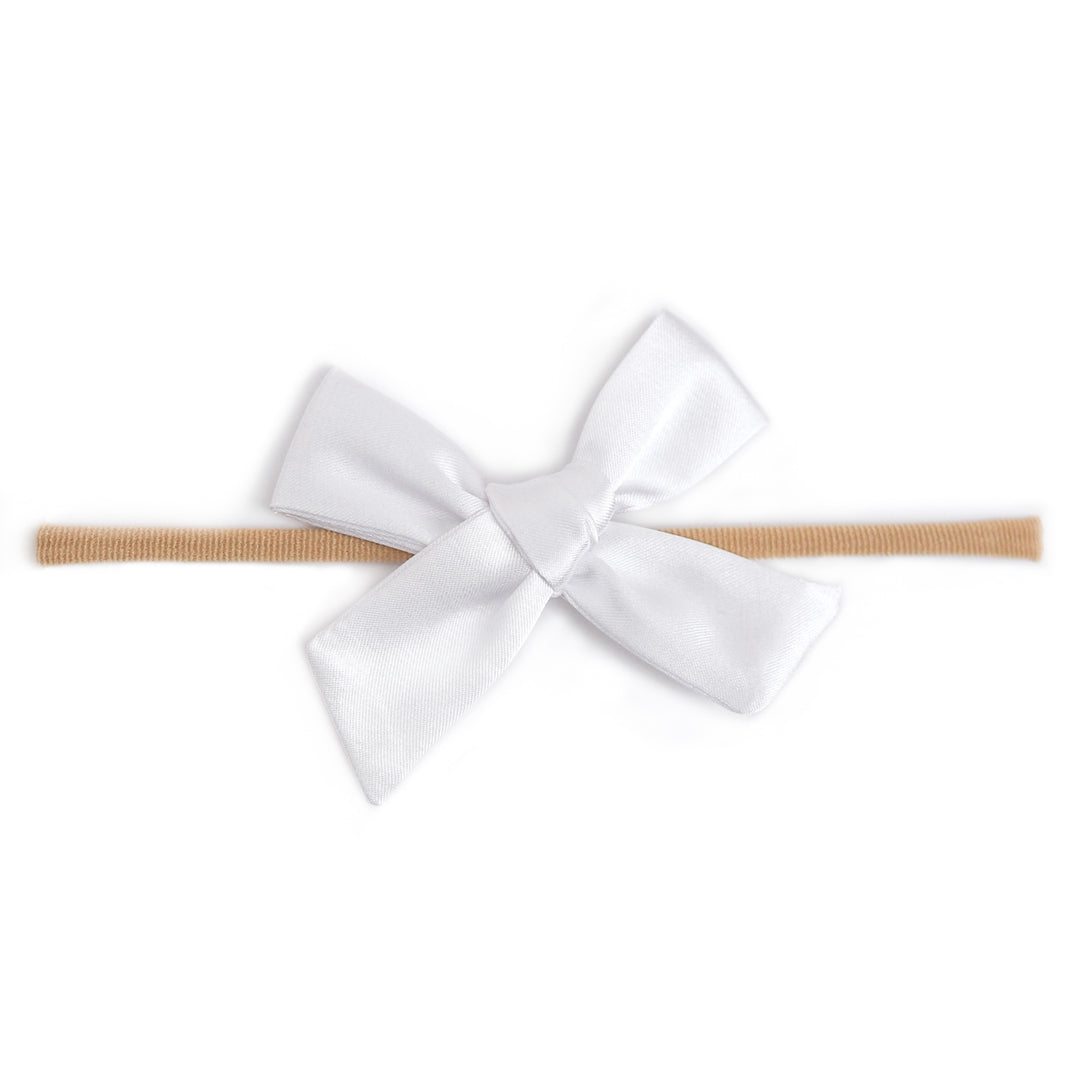 white satin bow on soft nylon band for baby girl
