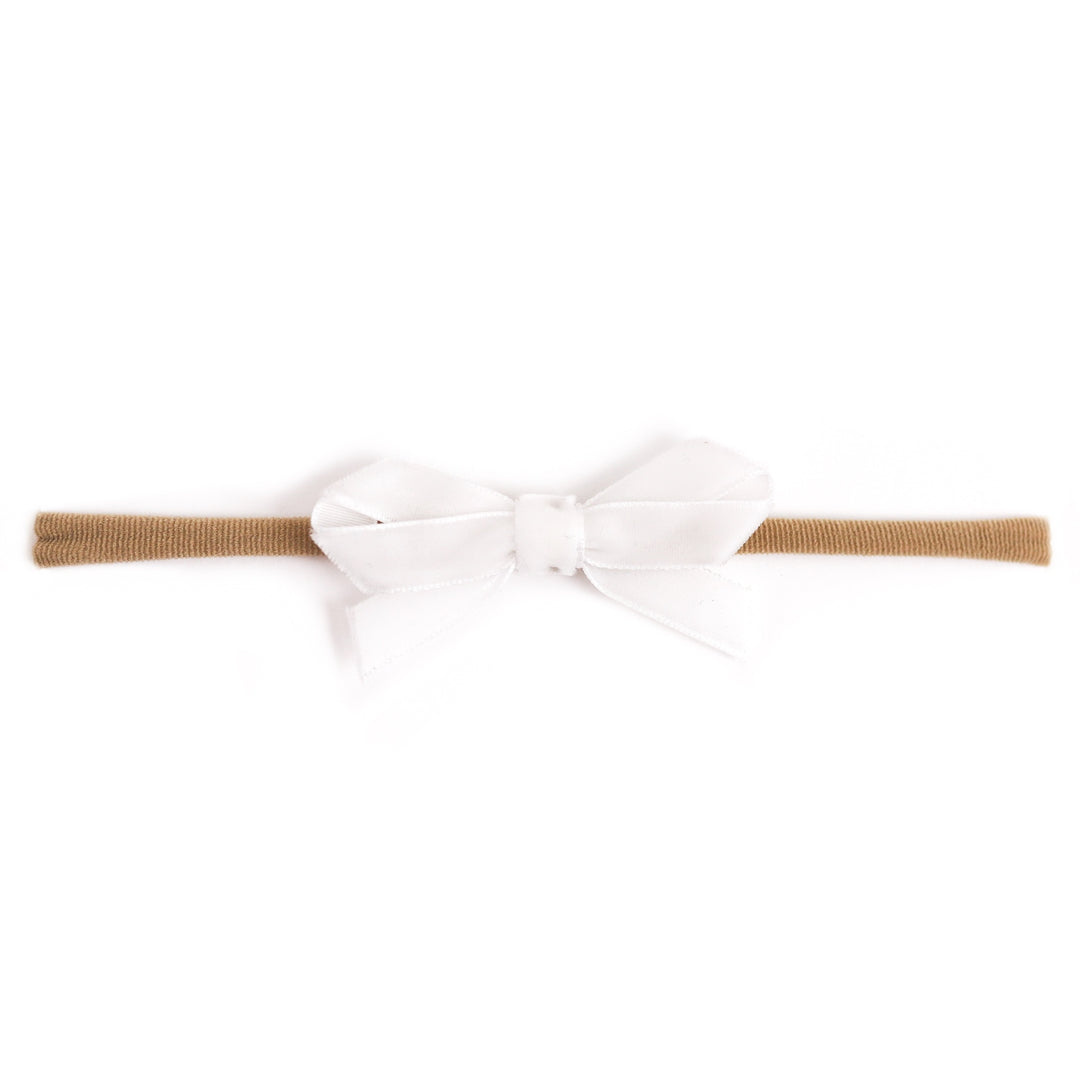baby girl's white velvet ribbon bow on stretchy nylon headband for spring and easter