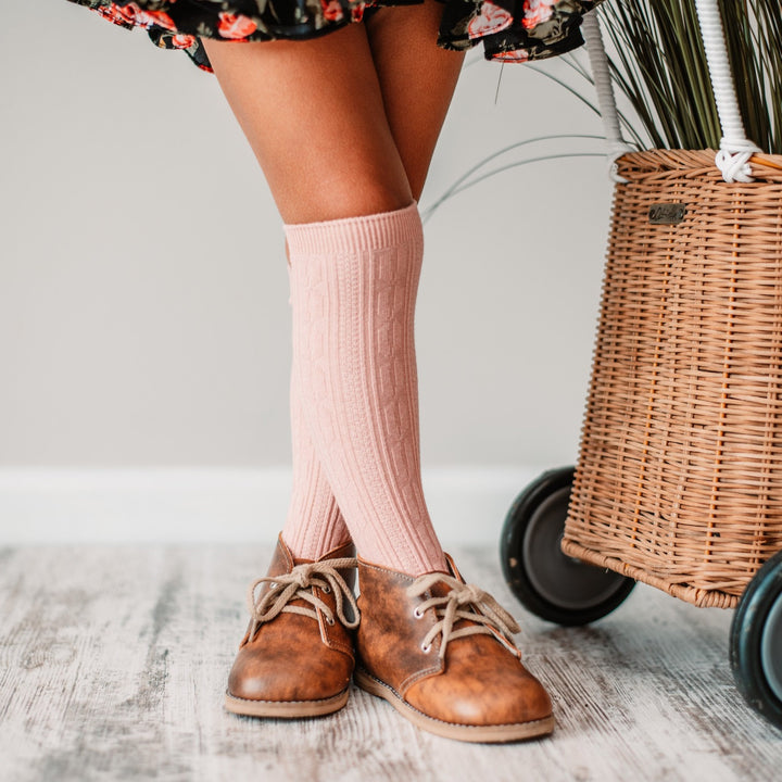 Little girl in blush pink knee highs
