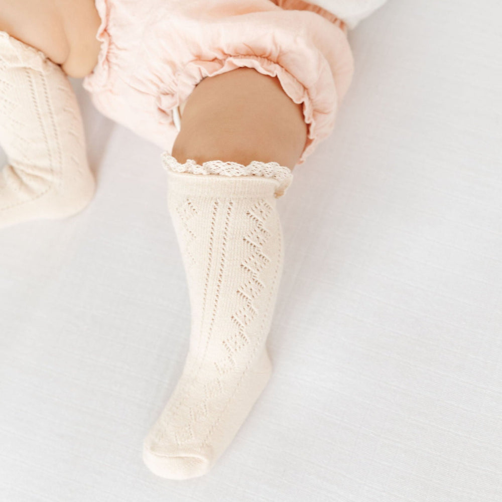 Vanilla fancy crochet lace sock on baby