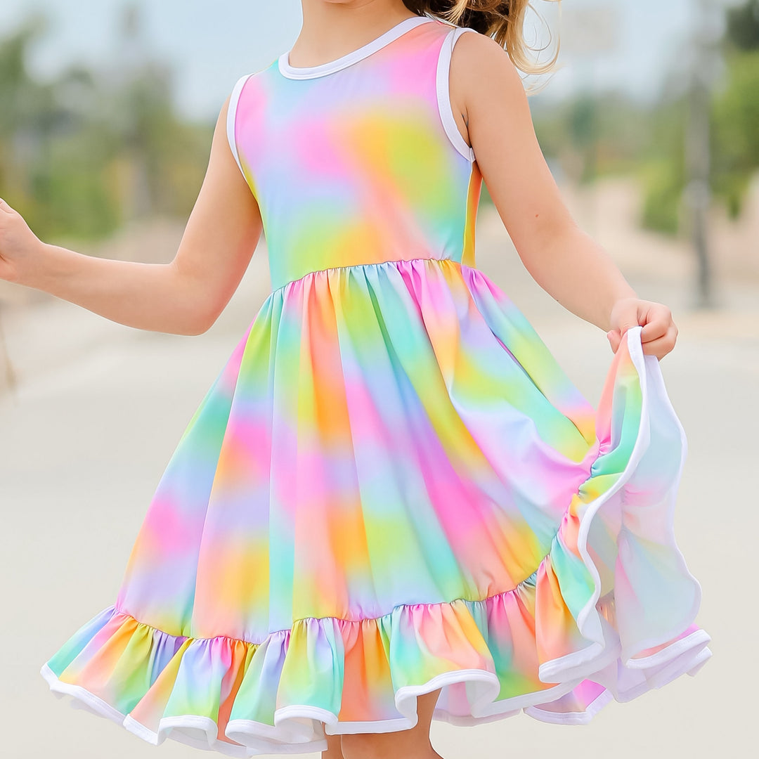 little girl twirling in rainbow heart dress
