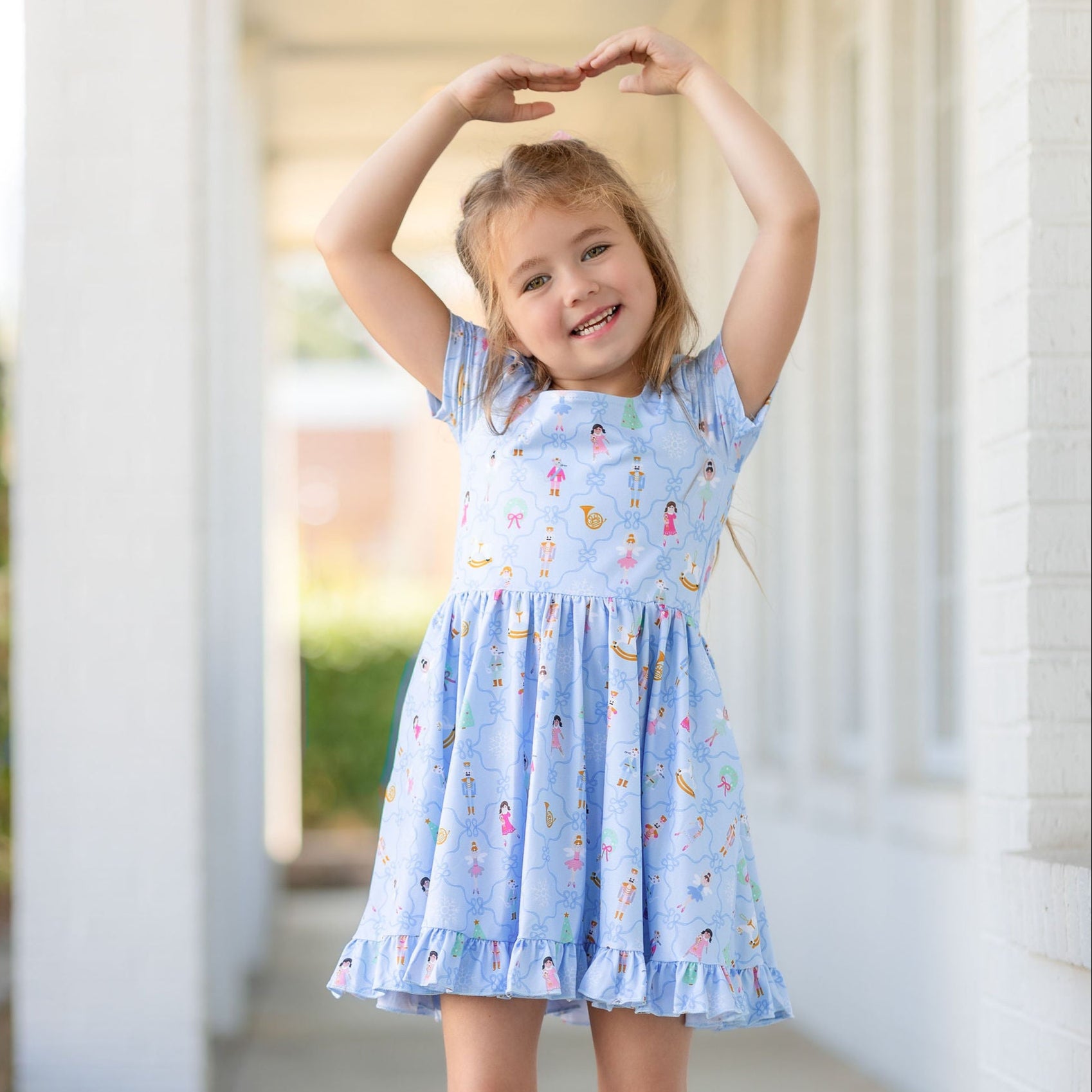 little girl dancing in nutcracker christmas dress