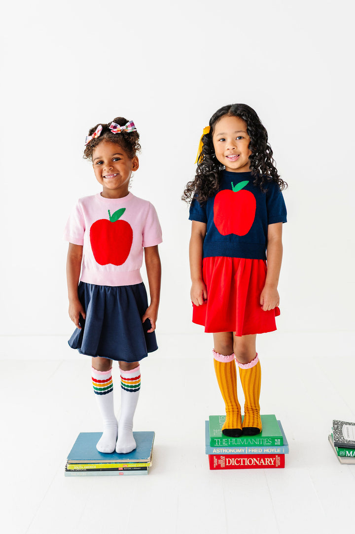 girls wearing big apple sweaters for back to school