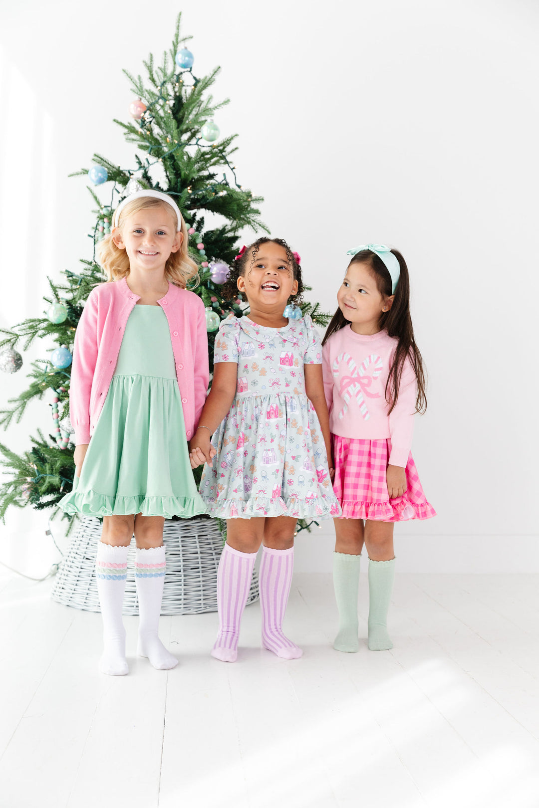 girls pastel christmas outfits with candy theme