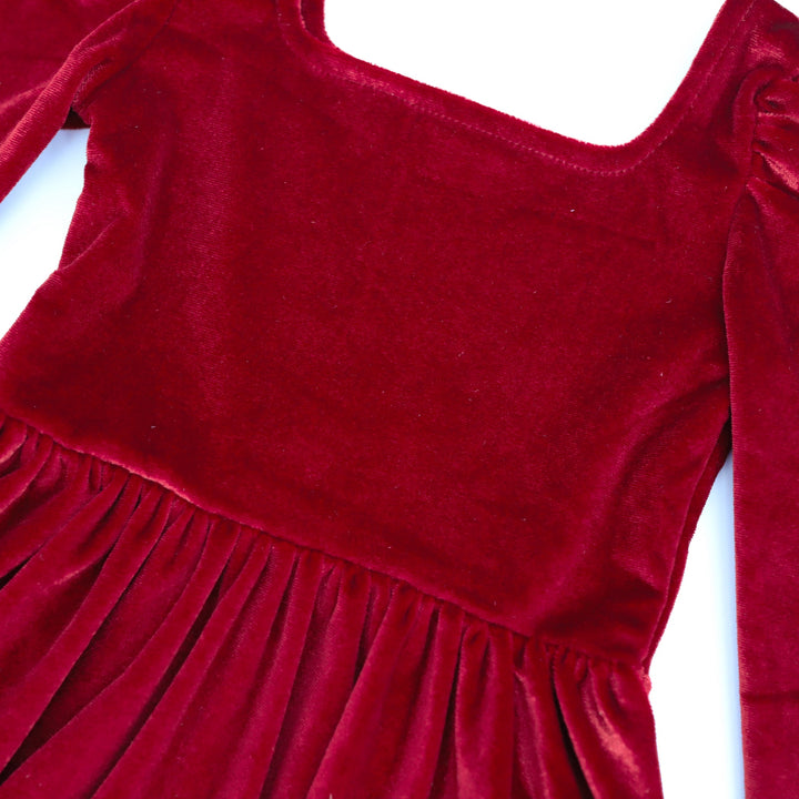 closeup of red velvet Christmas dress with square neckline