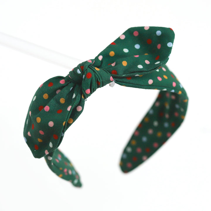 girls festive green fabric covered headband with colorful Christmas dots