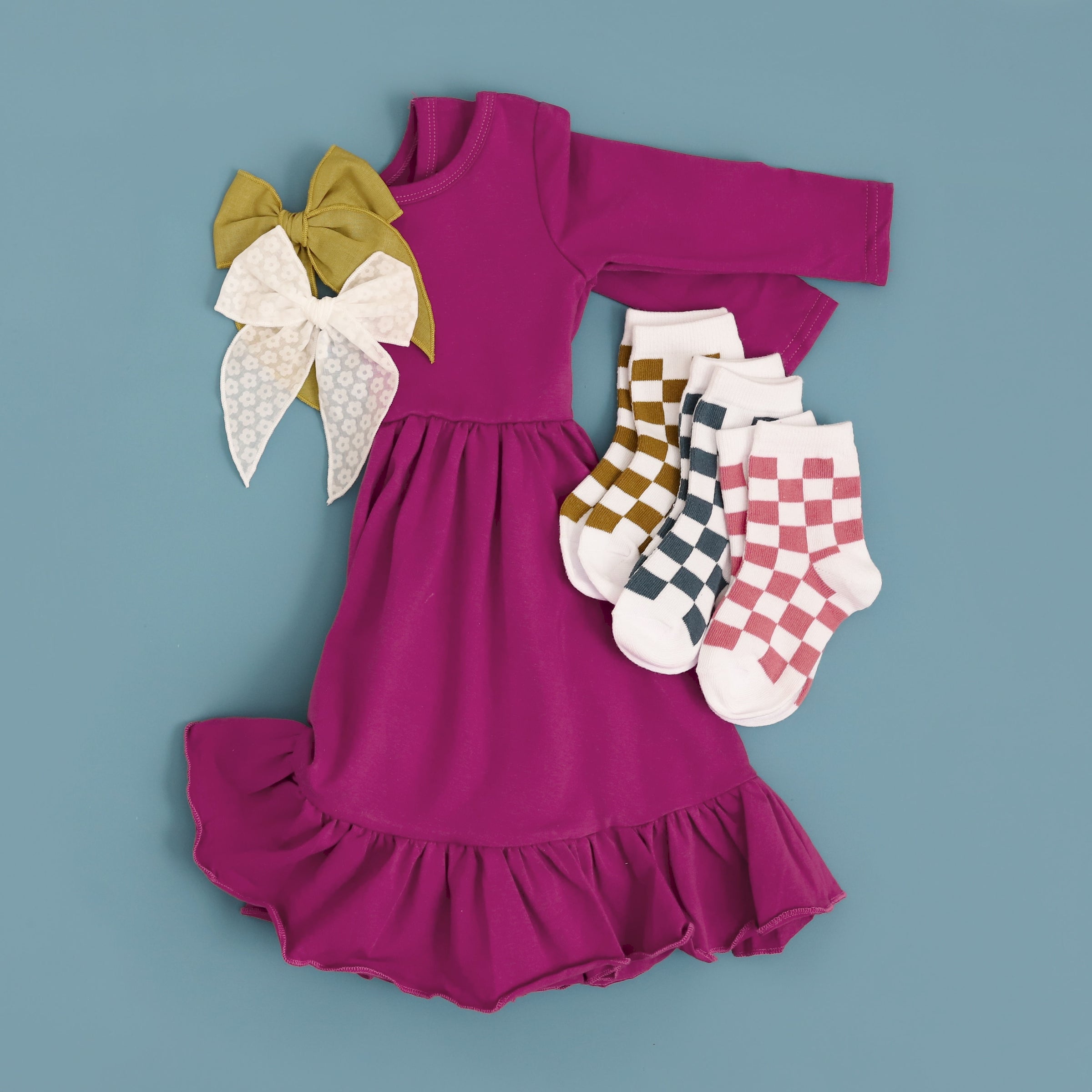 Girls Magenta Twirl dress with checkered socks and matching hair bows
