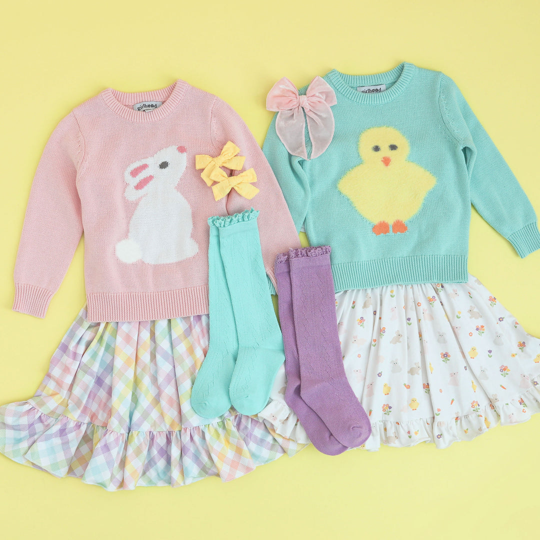 girls matching easter outfits with twirl dresses, knit sweaters, knee high socks and bows