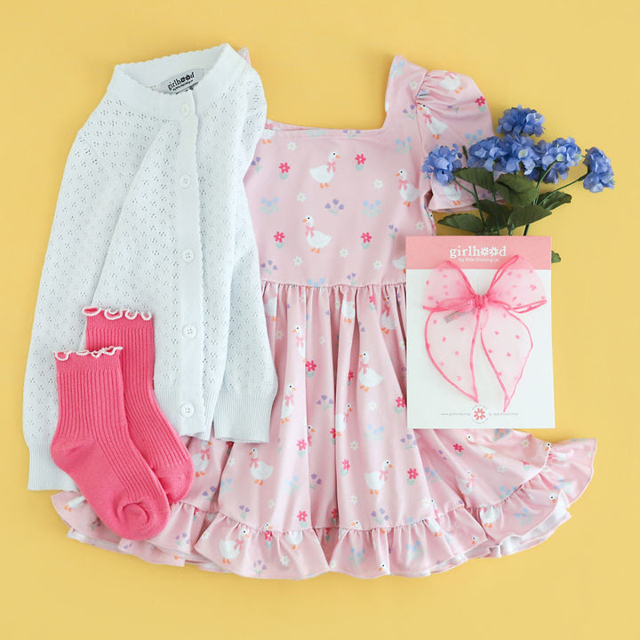 girls pink goose print dress with matching accessories for spring and easter