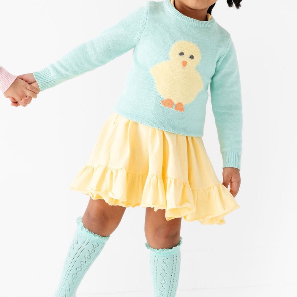 pastel yellow twirl dress paired with easter chick knit sweater for girls