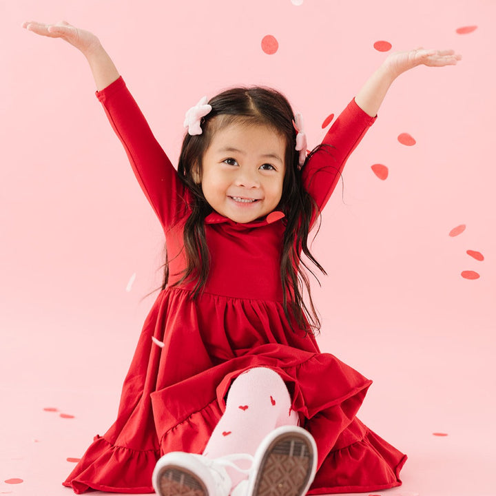little girl in red cotton twirl dress for valentine's day