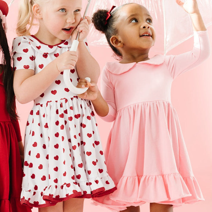 little girls in valentine's day twirl dresses