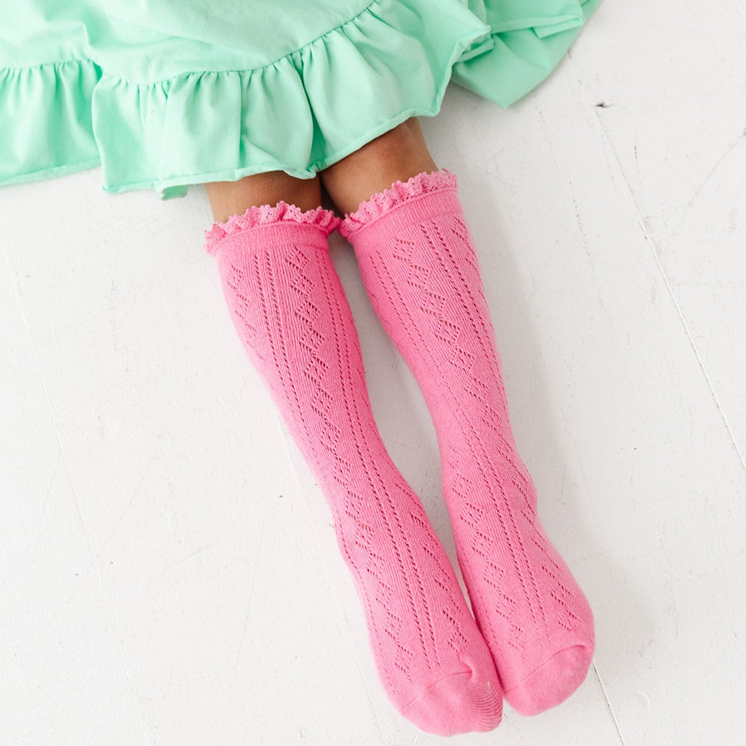 bright pink pointelle knit knee high socks with lace trim