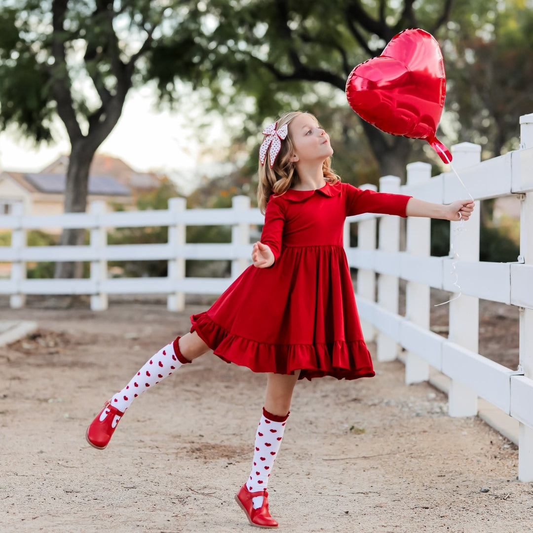 girls red twirl dress with peter pan collar and valentines hearts knee high socks
