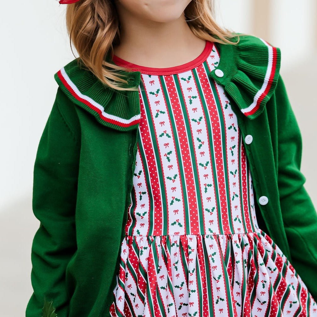 christmas cardigan for girls layered over matching twirl dress with holly and bows