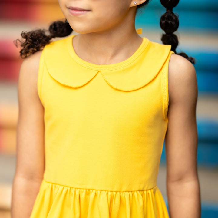 bodice and collar detail of bright yellow girls tank top style summer dress