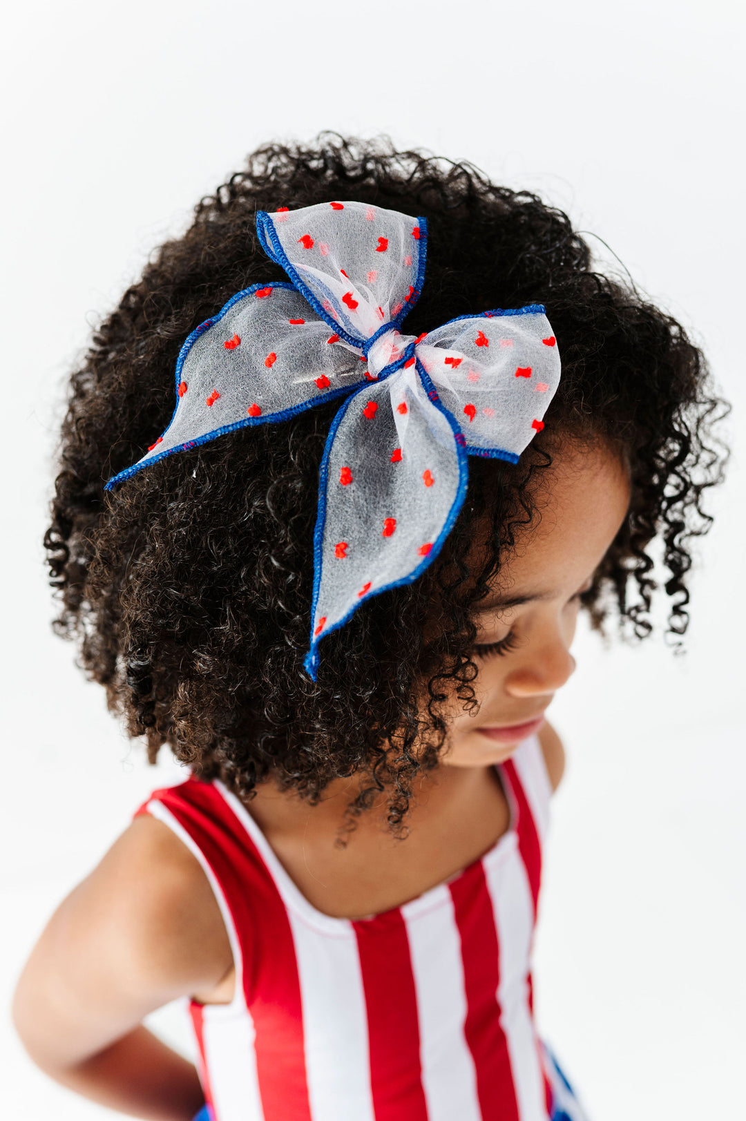 little girl in red, white and blue sheer dot fourth of july bow