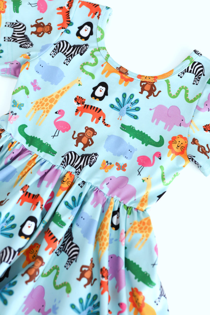 detail picture girls' short sleeve, ruffle hem twirl dress in mint with colorful zoo animal print