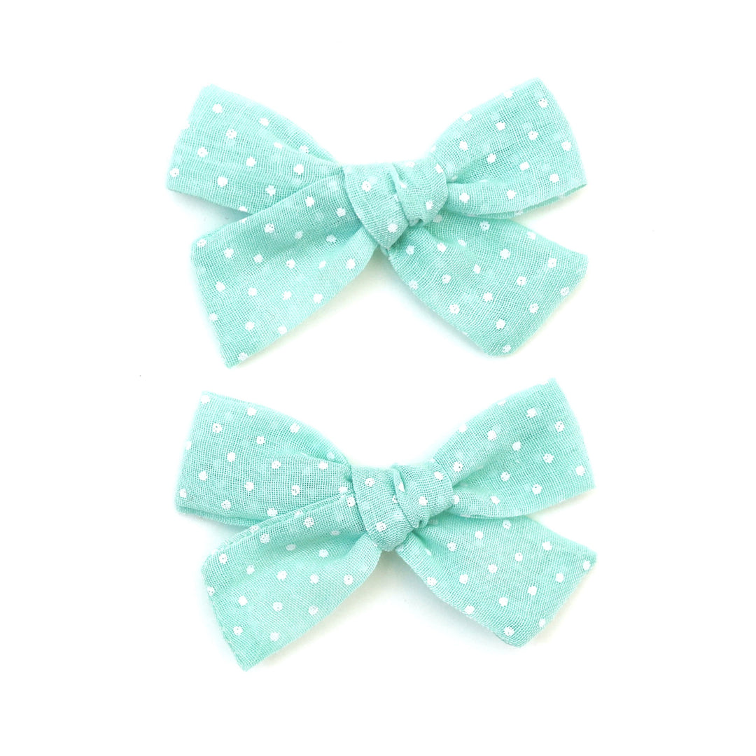 aqua blue pigtail bows with tiny white dots