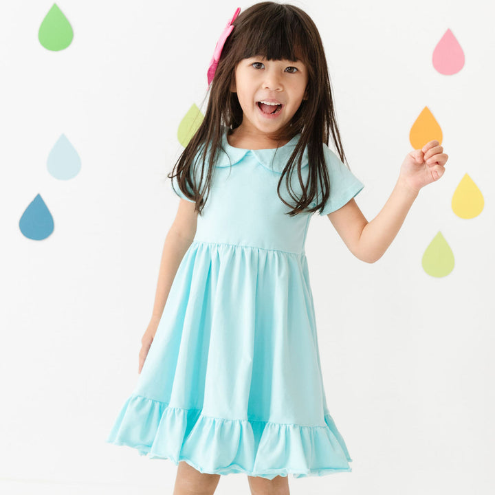 little girl in light aqua blue cotton twirl dress
