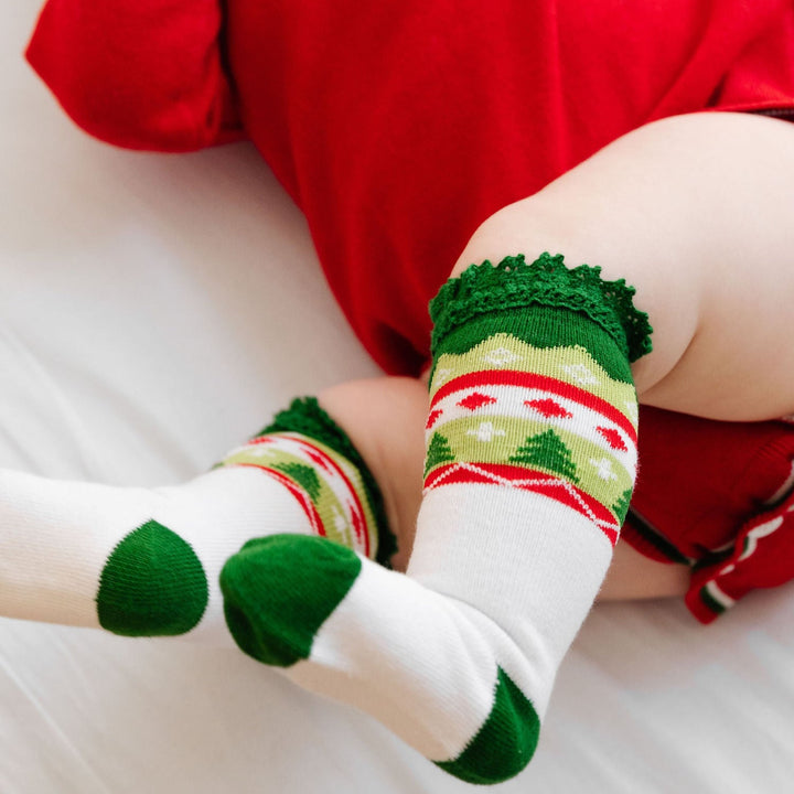baby wearing christmas knee high socks with lace and fair isle design