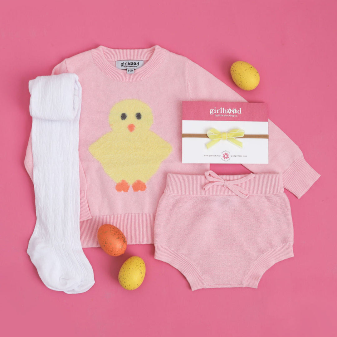 baby girls' pink knit pullover and bloomer set with fuzzy yellow chick design, white cable knit tights and yellow velvet ribbon bow for Easter