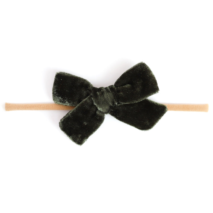 forest green velvet bow attached to nylon headband for baby