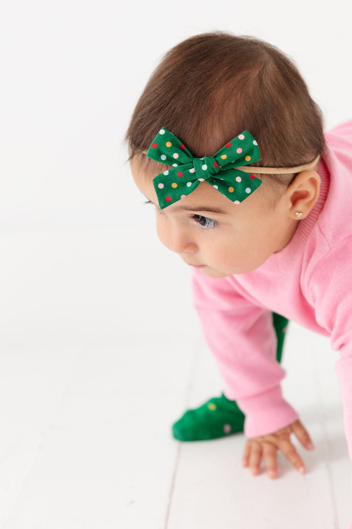 baby girl wearing christmas tree polka dot hair bow