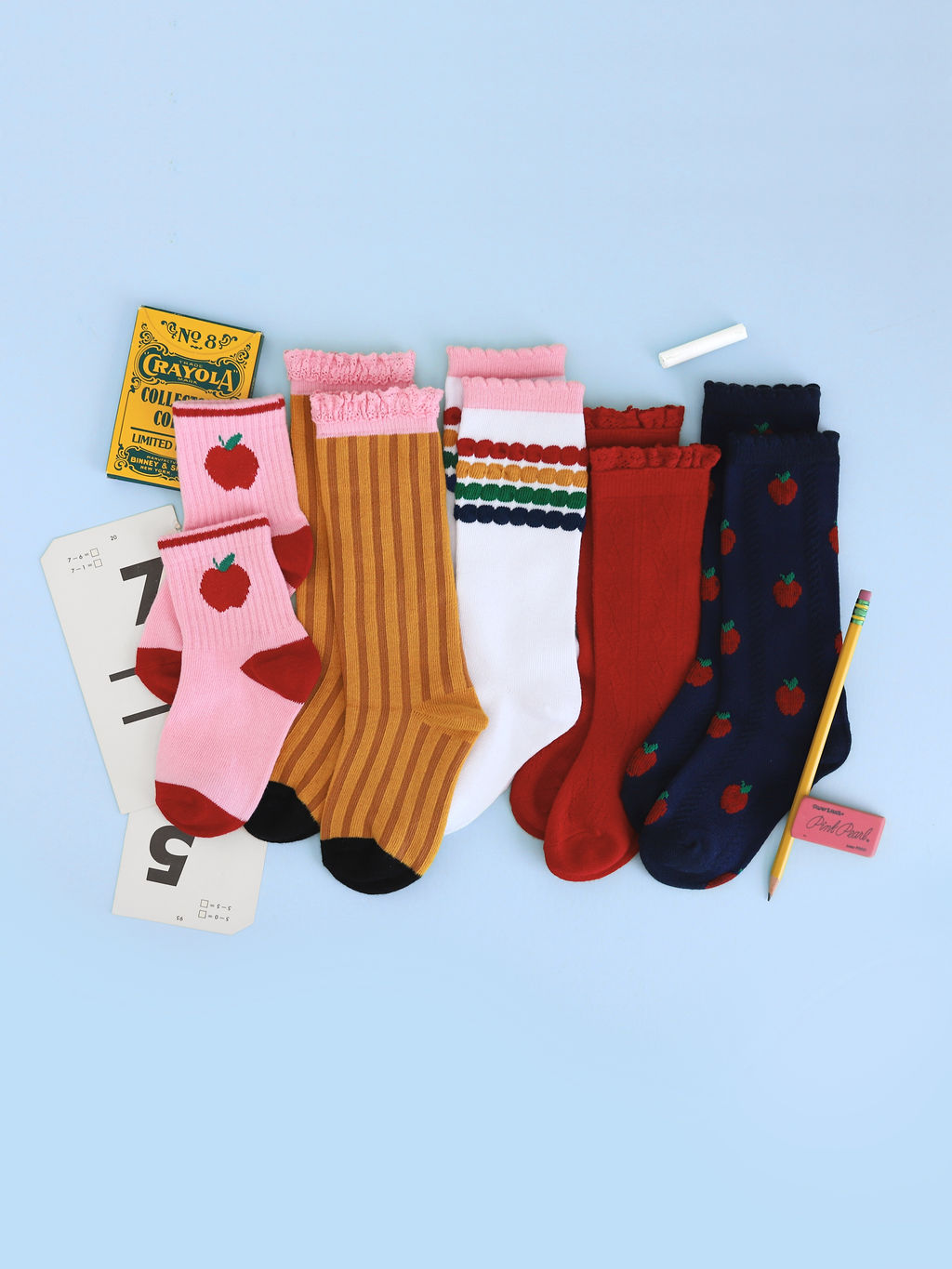 flat lay of girls' back to school pattern crew and knee socks