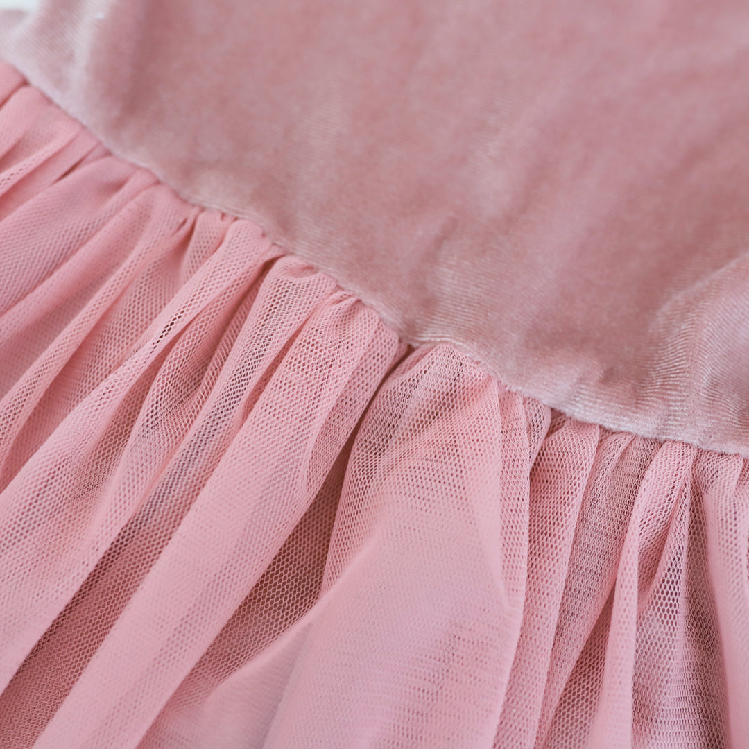 closeup of girls pink velvet holiday dress with tulle tutu skirt