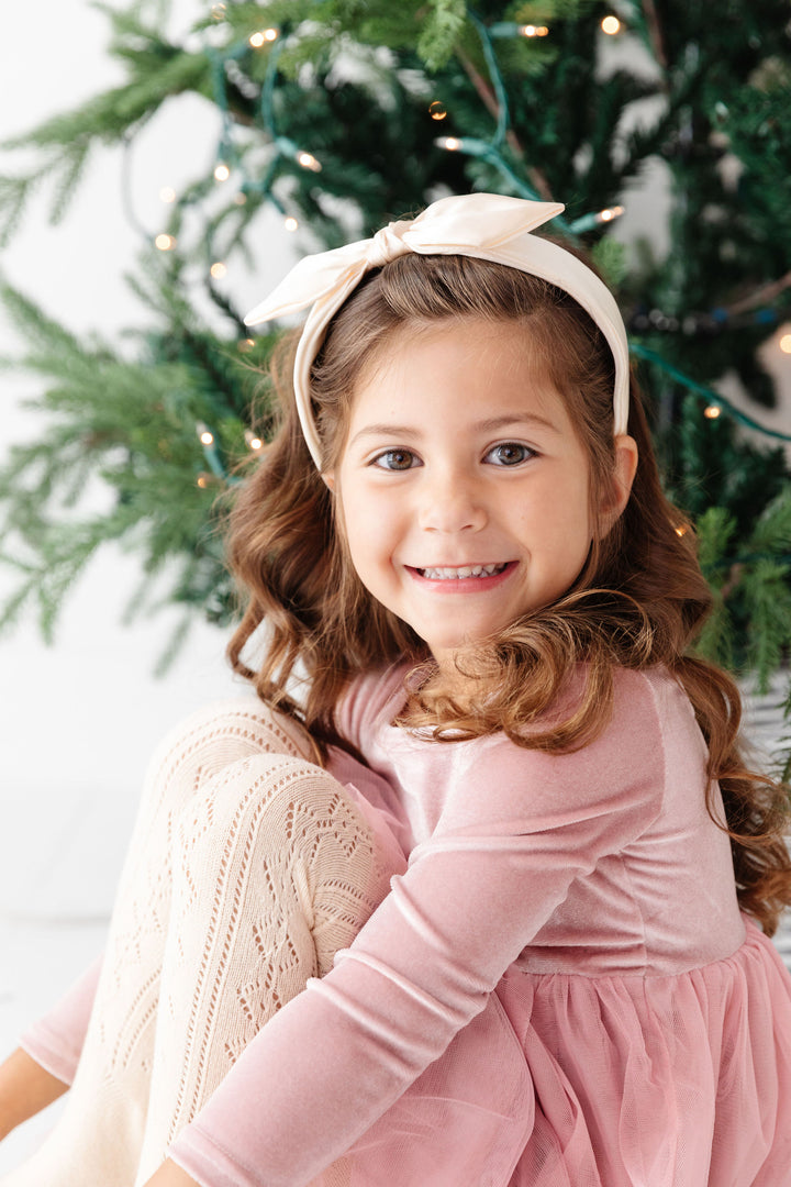 pink velvet party dress with matching vanilla fancy tights and vanilla satin bow headband