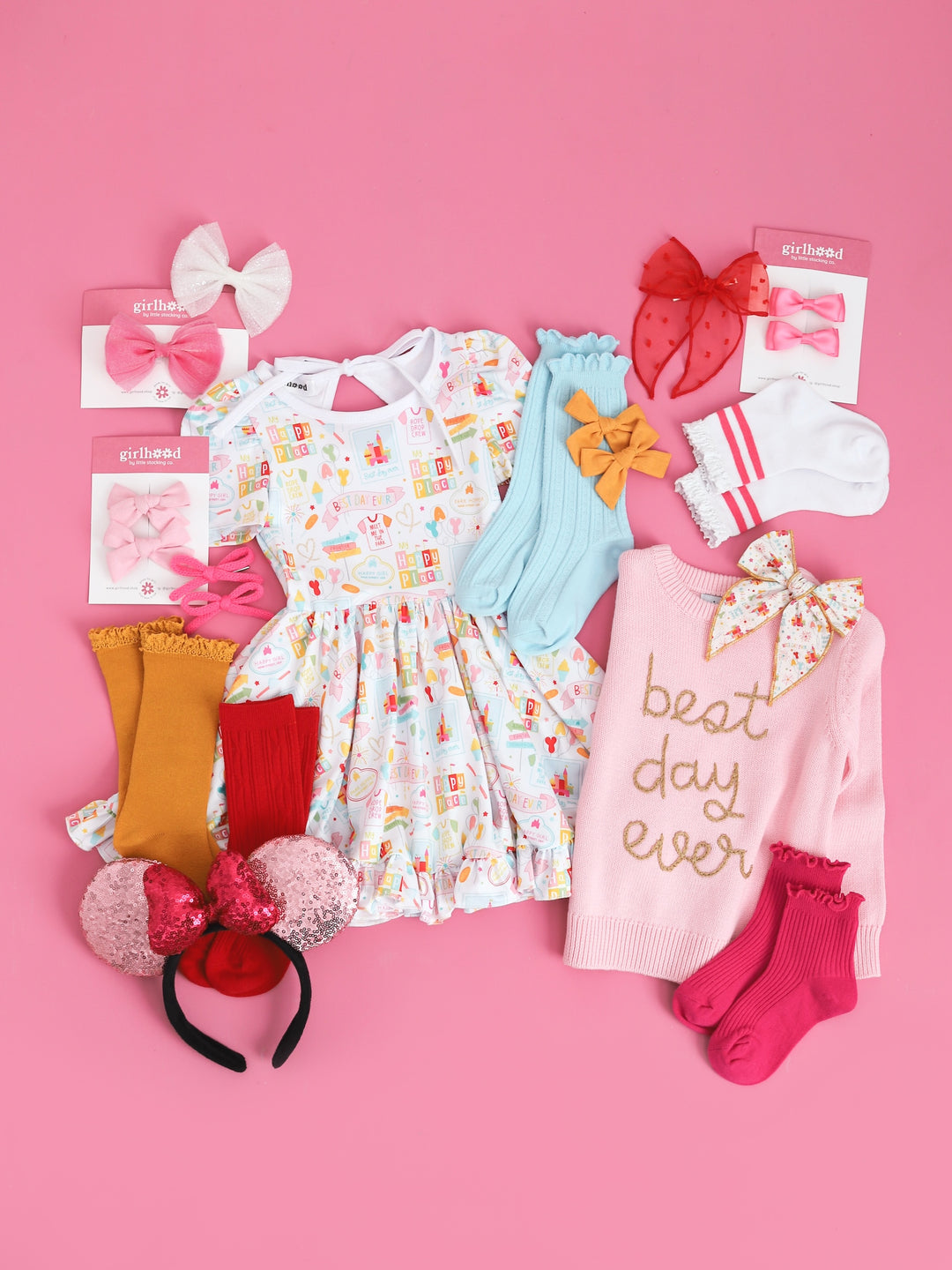 flatlay of girls disneyland inspired best day ever twirl dress with matching accessories