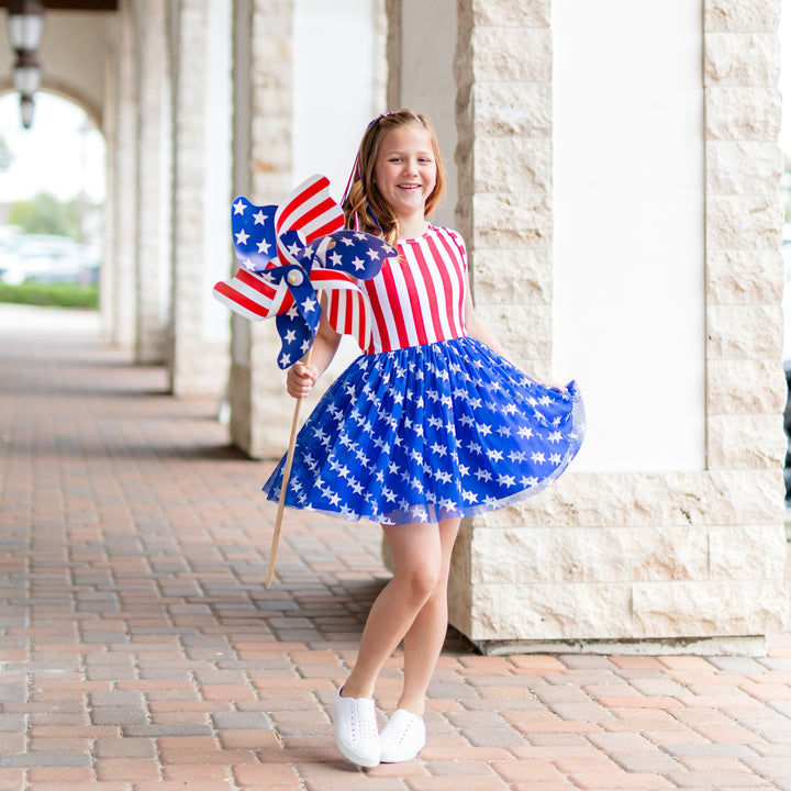 girl wearing 4th of july tutu set with in stars and stripes