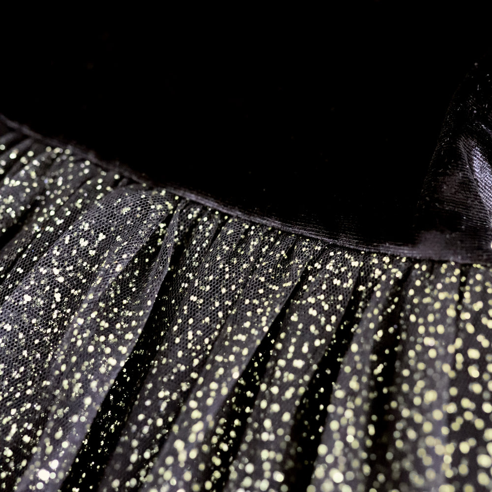 detail photo of girls party dress with black velvet top and gold sparkle tulle tutu skirt