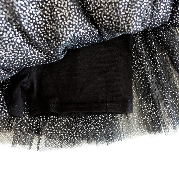 close-up of built in black biker shorts on sparkly black tutu skort