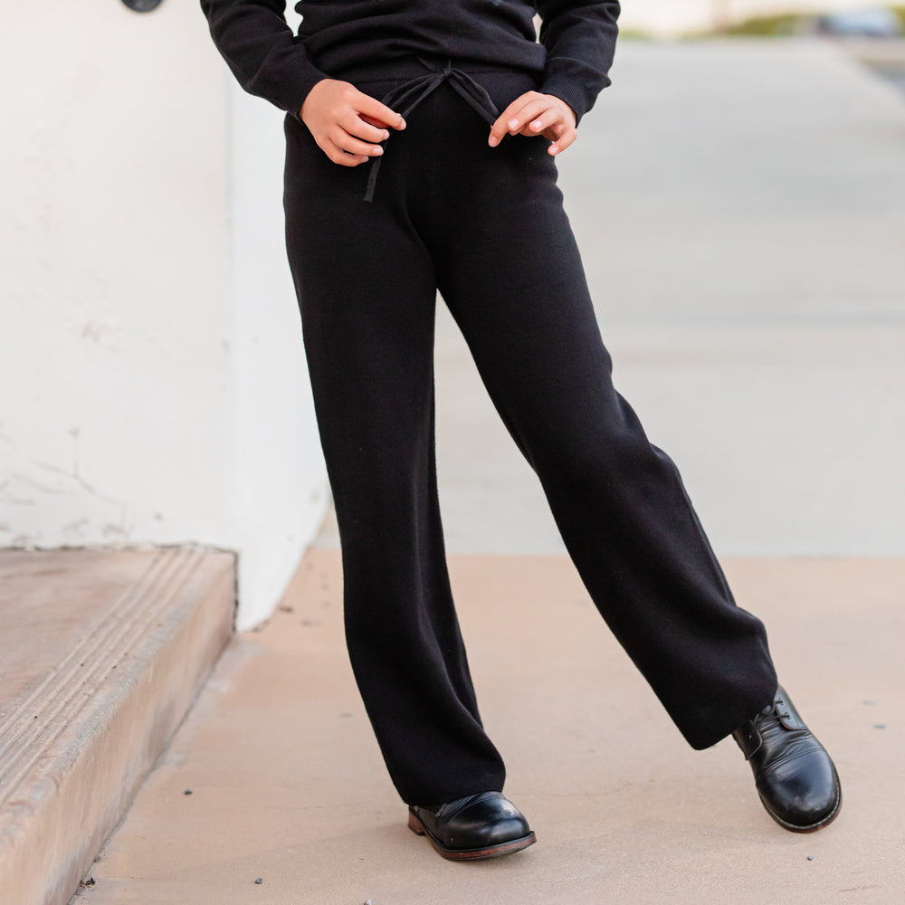 girl in 100% cotton knit sweater pants with drawstring waistband and black boots