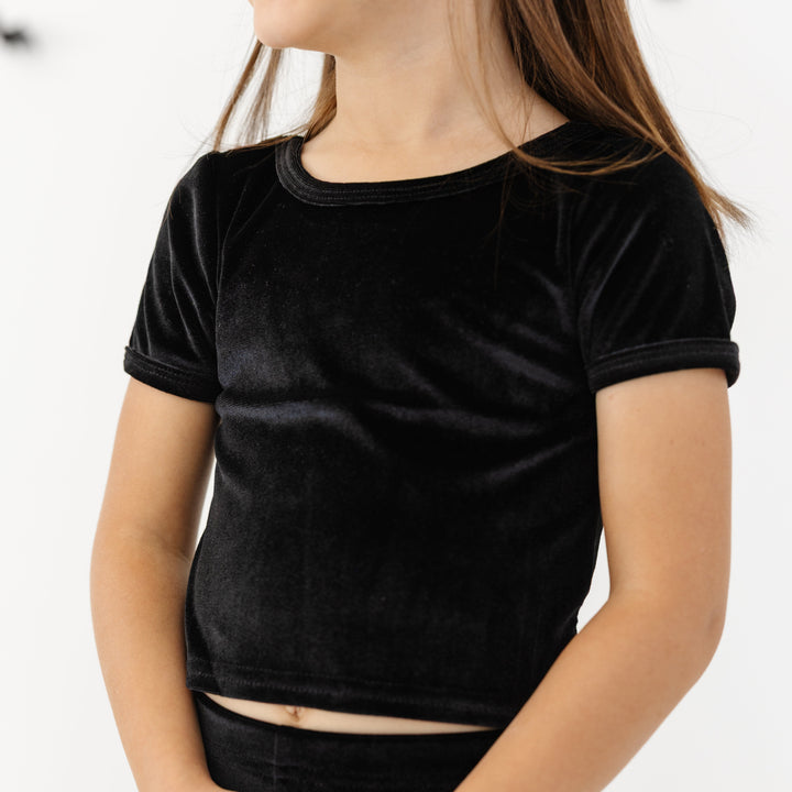 little girl in soft, stretchy black velvet fitted top and matching leggings for Halloween